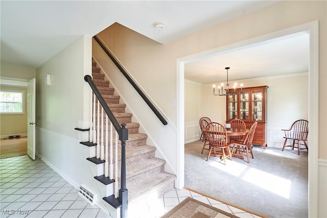 7304 Glastonbury Dr, Hudson, OH 44236 - stairs with a chandelier, tile patterned flooring, and carpet flooring