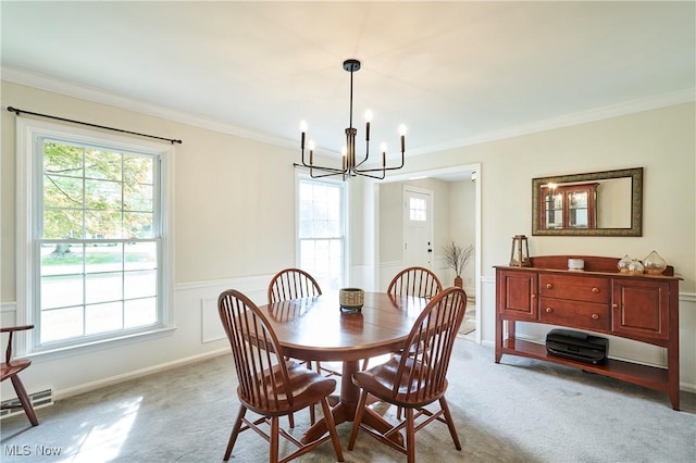 7304 Glastonbury Dr, Hudson, OH 44236 - dining space with a chandelier, healthy amount of natural light, carpet, ornamental molding, and wainscoting
