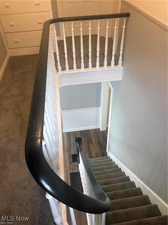 566 N Walnut St, Wooster, OH 44691 - staircase featuring baseboards