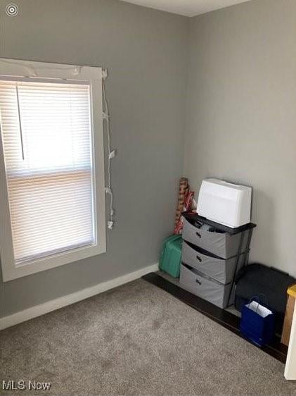 566 N Walnut St, Wooster, OH 44691 - carpeted bedroom featuring baseboards