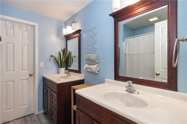 80 Landings Way, Avon Lake, OH 44012 - full bathroom featuring wood finished floors and two vanities