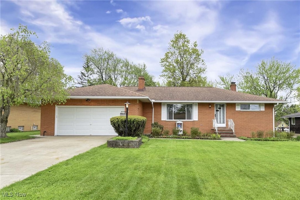 1159 Orchardview Rd, Seven Hills, OH 44131 - single story home featuring a chimney, an attached garage, driveway, and brick siding