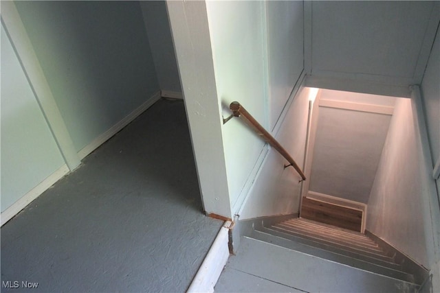 923 W 58th St, Ashtabula, OH 44004 - stairway featuring baseboards