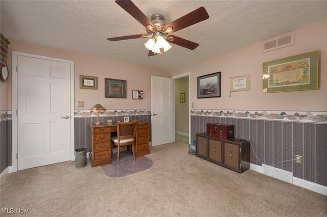 6352 Creekside Trl, Solon, OH 44139 - office space with carpet, a wainscoted wall, ceiling fan, and a textured ceiling
