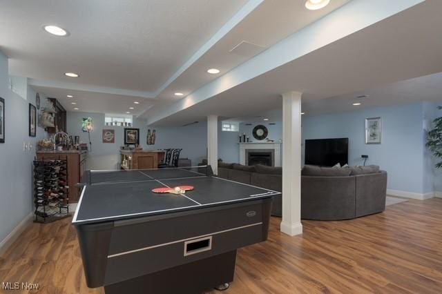 6352 Creekside Trl, Solon, OH 44139 - recreation room featuring a dry bar, baseboards, wood finished floors, a fireplace, and recessed lighting