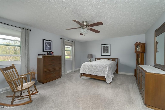 6352 Creekside Trl, Solon, OH 44139 - bedroom with a textured ceiling, light carpet, and baseboards