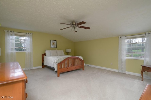 6352 Creekside Trl, Solon, OH 44139 - bedroom featuring lofted ceiling, light carpet, baseboards, and ceiling fan