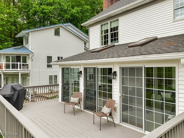 deck featuring a grill