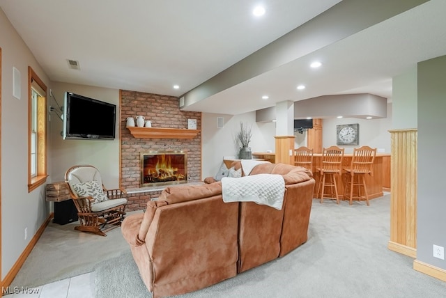 living room with light carpet, recessed lighting, a fireplace, bar, and baseboards