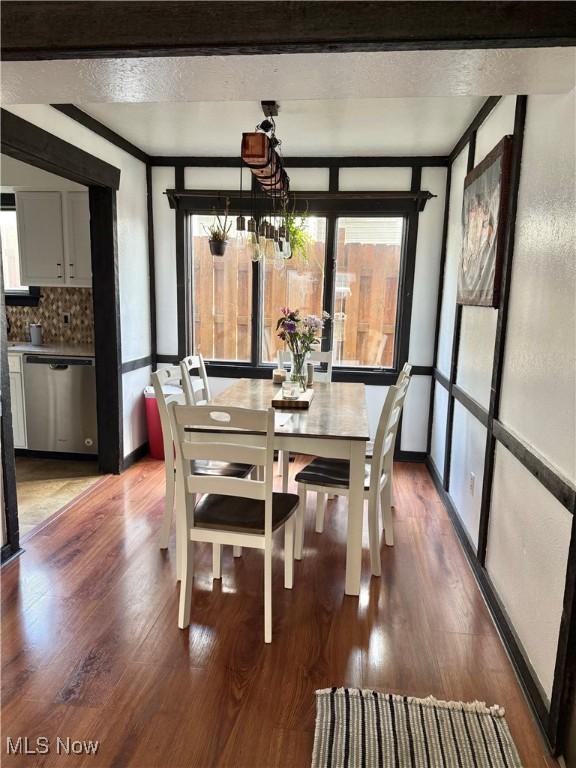 5460 Coronada Dr, Mentor-On-The-Lake, OH 44060 - dining room featuring healthy amount of natural light, wood finished floors, and a chandelier