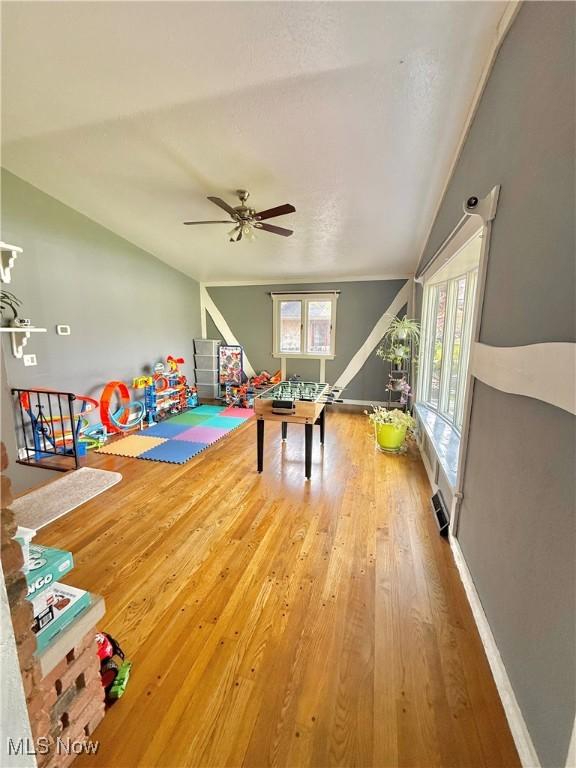 5460 Coronada Dr, Mentor-On-The-Lake, OH 44060 - playroom featuring vaulted ceiling, wood finished floors, a ceiling fan, and baseboards