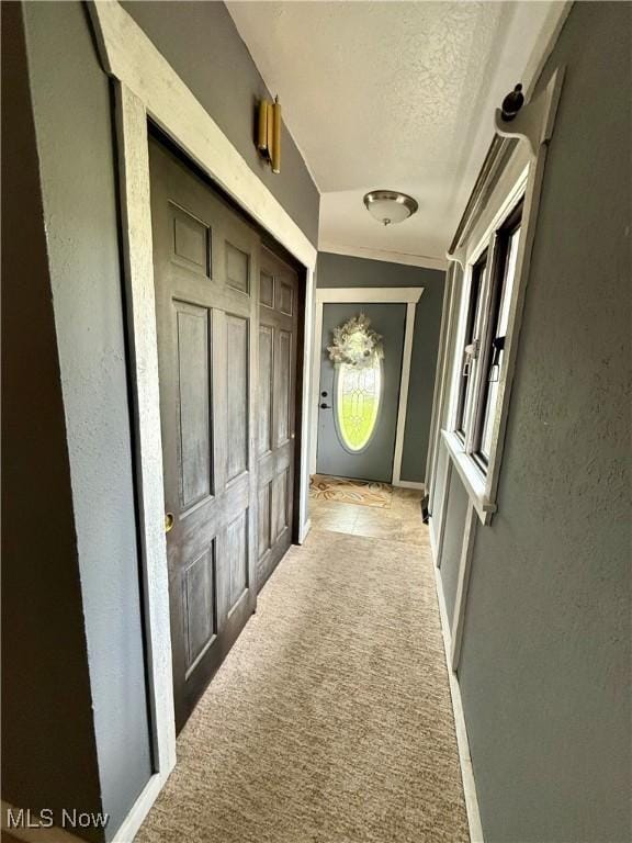 5460 Coronada Dr, Mentor-On-The-Lake, OH 44060 - corridor featuring a textured ceiling, light colored carpet, baseboards, and a textured wall