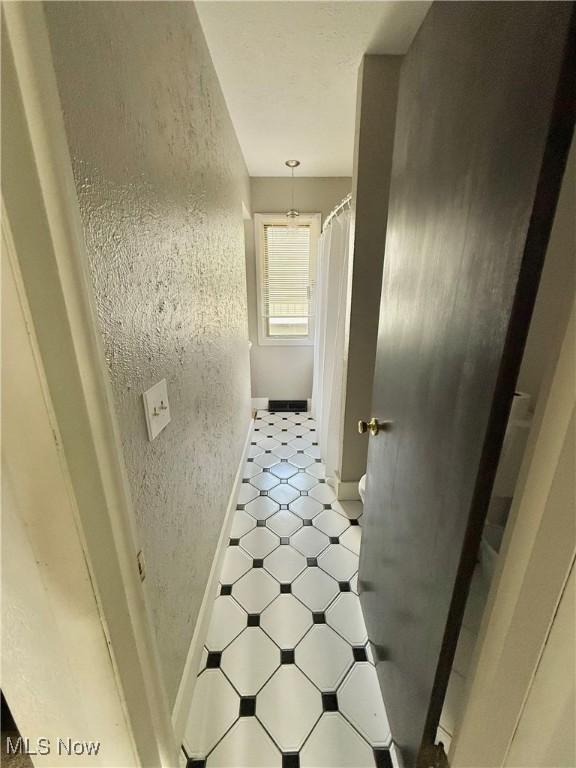 5460 Coronada Dr, Mentor-On-The-Lake, OH 44060 - corridor featuring baseboards and light floors