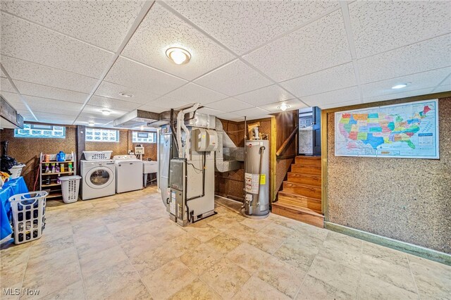 5460 Coronada Dr, Mentor-On-The-Lake, OH 44060 - basement with washing machine and dryer, gas water heater, a drop ceiling, heating unit, and stairway