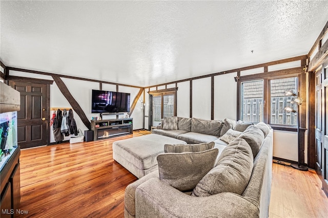 5460 Coronada Dr, Mentor-On-The-Lake, OH 44060 - living room with a textured ceiling and light wood-type flooring