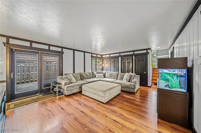 5460 Coronada Dr, Mentor-On-The-Lake, OH 44060 - living area featuring wood finished floors and a textured ceiling