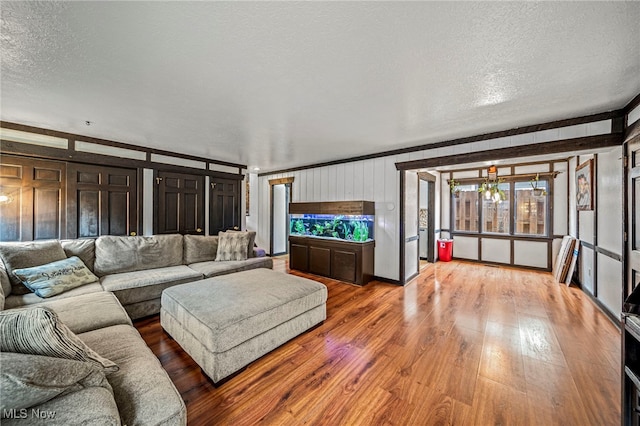 5460 Coronada Dr, Mentor-On-The-Lake, OH 44060 - living area featuring a textured ceiling, wood finished floors, and wooden walls