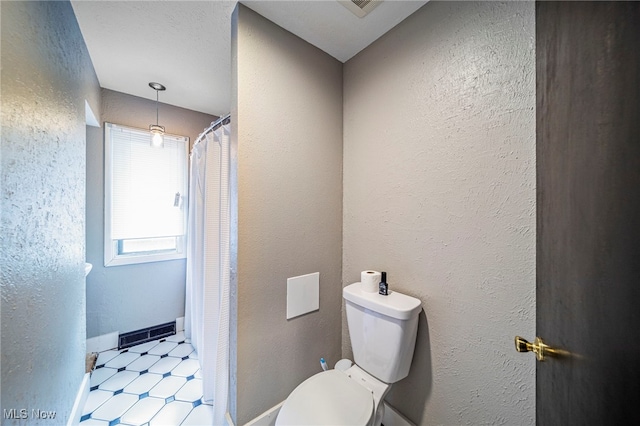 5460 Coronada Dr, Mentor-On-The-Lake, OH 44060 - full bathroom featuring tile patterned floors, toilet, and a textured wall