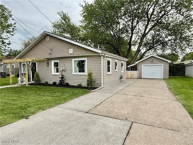 4812 Irma Ave, Youngstown, OH 44514 - view of front of house featuring an outbuilding, a detached garage, and driveway