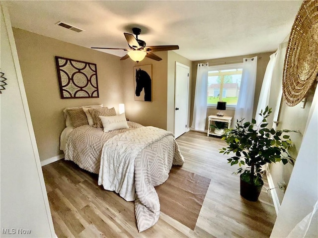 4812 Irma Ave, Youngstown, OH 44514 - bedroom featuring wood finished floors, ceiling fan, and baseboards
