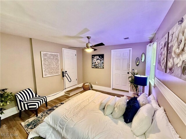 4812 Irma Ave, Youngstown, OH 44514 - bedroom with wood finished floors, baseboards, and a ceiling fan