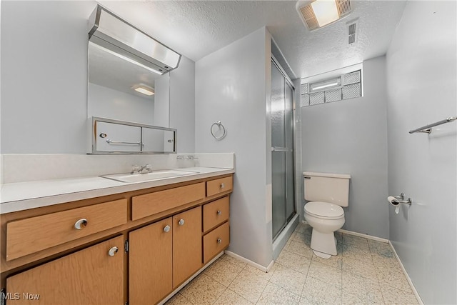 4713 Forest Edge Dr, Brooklyn, OH 44144 - bathroom featuring baseboards, toilet, a stall shower, vanity, and a textured ceiling