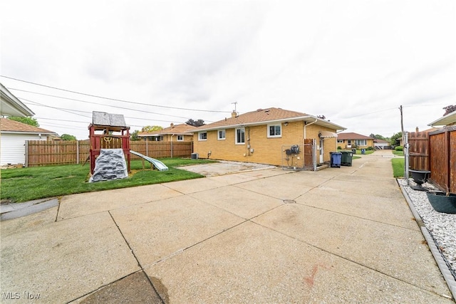 4713 Forest Edge Dr, Brooklyn, OH 44144 - rear view of house featuring a playground, a patio area, and brick siding