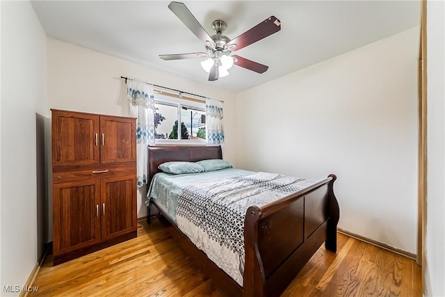 4713 Forest Edge Dr, Brooklyn, OH 44144 - bedroom with light wood finished floors and a ceiling fan