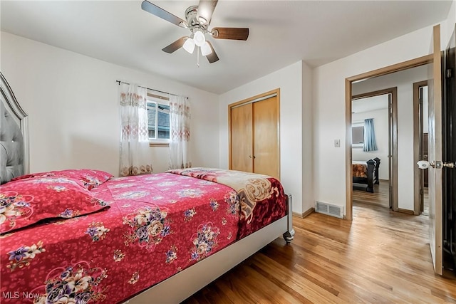 4713 Forest Edge Dr, Brooklyn, OH 44144 - bedroom with light wood-style floors, a closet, ceiling fan, and baseboards