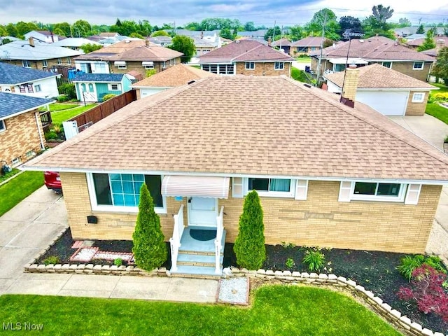 4713 Forest Edge Dr, Brooklyn, OH 44144 - view of front of home featuring roof with shingles, brick siding, and a residential view