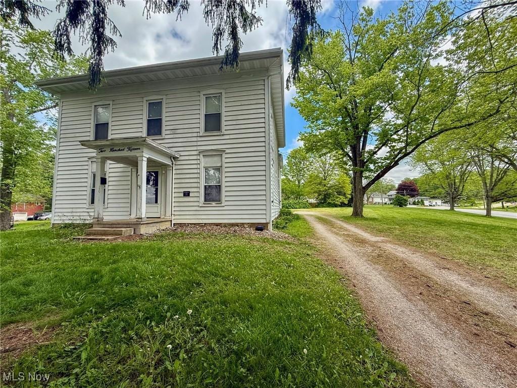 215 High St, Lodi, OH 44254 - view of front of property featuring driveway and a front yard