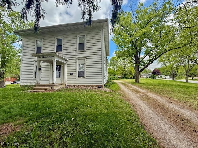 215 High St, Lodi, OH 44254 - view of front of property featuring driveway and a front yard