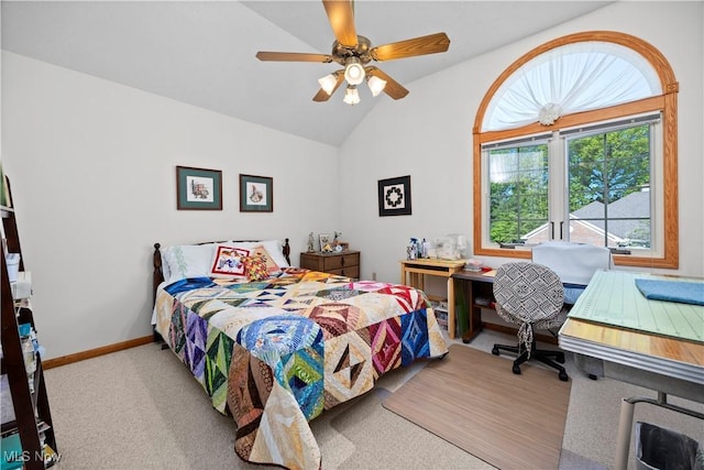 carpeted bedroom featuring vaulted ceiling, baseboards, and a ceiling fan