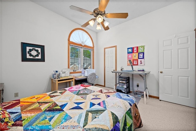 carpeted bedroom with ceiling fan and baseboards
