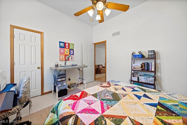 bedroom featuring a ceiling fan and high vaulted ceiling