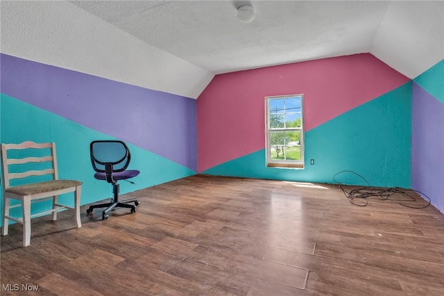 563 Mill St, Conneaut, OH 44030 - bonus room featuring vaulted ceiling and wood finished floors