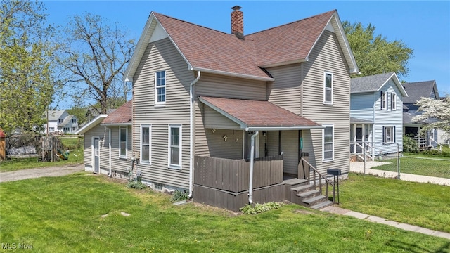 563 Mill St, Conneaut, OH 44030 - view of front of property with covered porch, a chimney, and a shingled roof