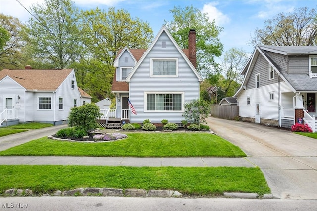211 Harcourt Dr, Akron, OH 44313 - view of front of property featuring a chimney and driveway
