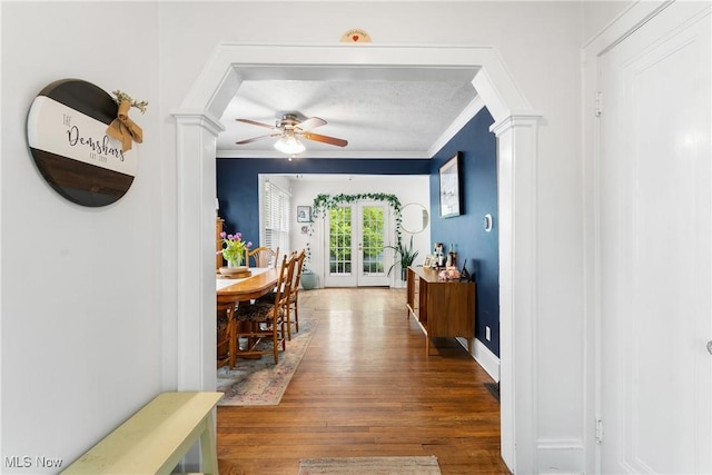 211 Harcourt Dr, Akron, OH 44313 - hallway featuring french doors, wood finished floors, crown molding, decorative columns, and baseboards