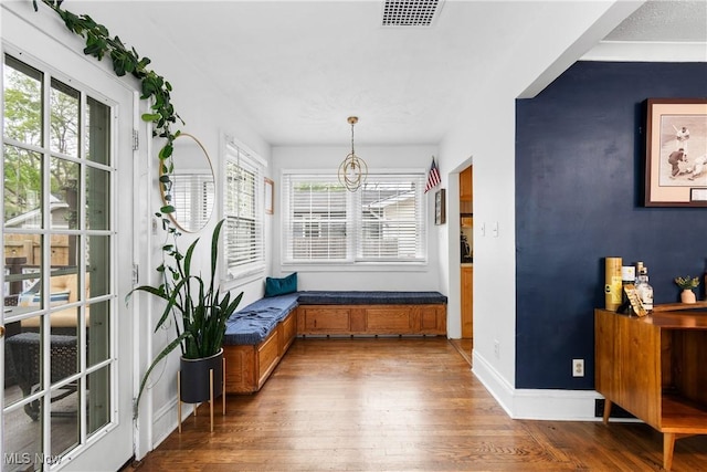 211 Harcourt Dr, Akron, OH 44313 - interior space with wood finished floors, a chandelier, and baseboards
