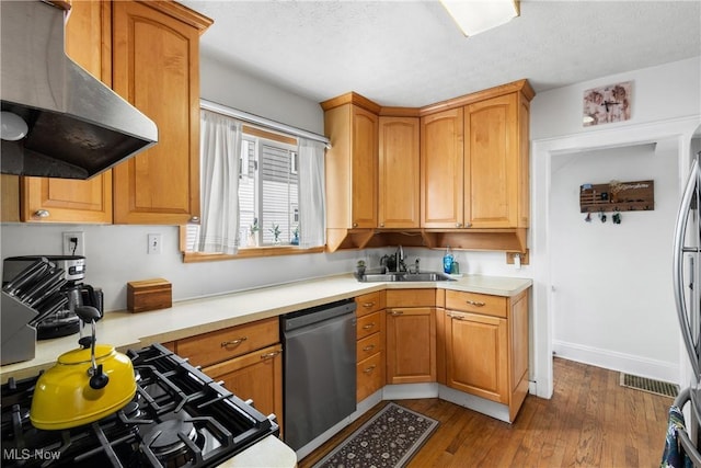 211 Harcourt Dr, Akron, OH 44313 - kitchen featuring island exhaust hood, stainless steel appliances, a sink, light countertops, and dark wood-style flooring