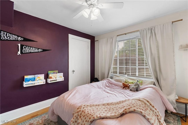 211 Harcourt Dr, Akron, OH 44313 - bedroom with wood finished floors, baseboards, ceiling fan, and a closet