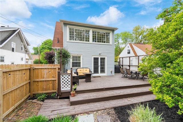 211 Harcourt Dr, Akron, OH 44313 - rear view of house with an outdoor living space, fence, a wooden deck, and outdoor dining space