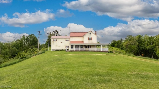50504 State Route 556, Clarington, OH 43915 - rear view of house with a lawn and a chimney
