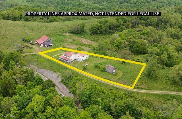 50504 State Route 556, Clarington, OH 43915 - aerial view of property and surrounding area with property parcel outlined and a forest