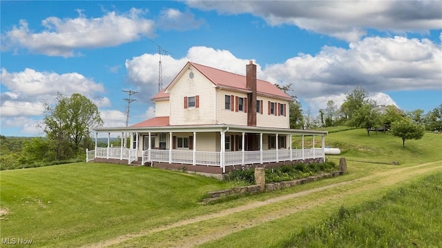50504 State Route 556, Clarington, OH 43915 - back of house featuring a porch, a yard, metal roof, and a chimney