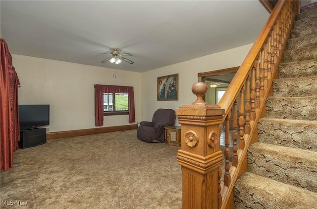 50504 State Route 556, Clarington, OH 43915 - sitting room featuring a ceiling fan, carpet floors, baseboards, and stairs
