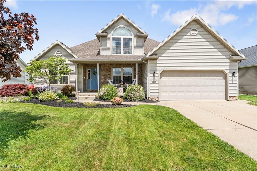 4968 Sippo Reserves Dr NW, Massillon, OH 44647 - traditional home with concrete driveway, a front yard, a porch, a garage, and roof with shingles
