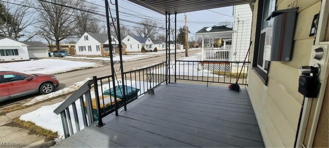 5161 Greenhurst Dr, Maple Heights, OH 44137 - snow covered deck with covered porch and a residential view
