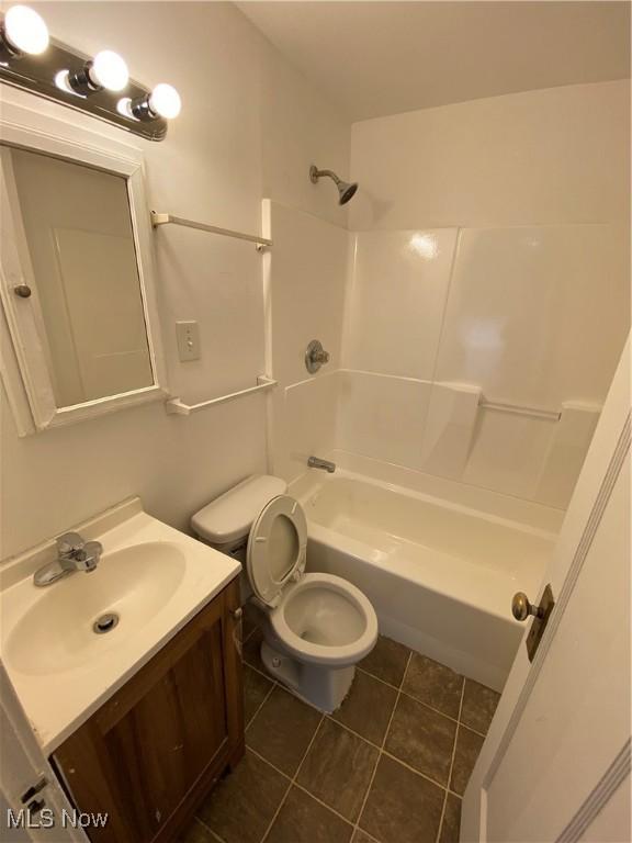 5161 Greenhurst Dr, Maple Heights, OH 44137 - bathroom featuring tile patterned flooring, vanity, shower / tub combination, and toilet